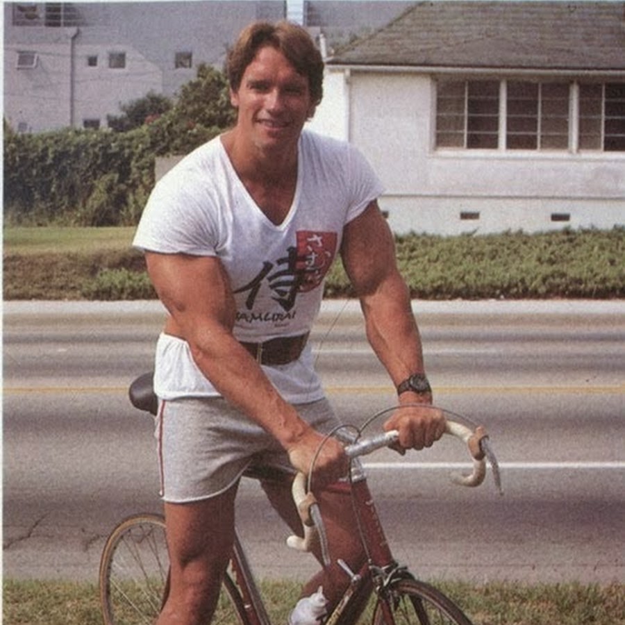 Old picture of Arnold Schwarzenegger on a road bike